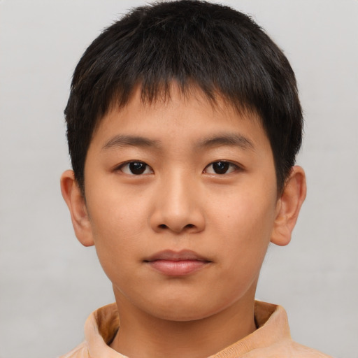 Neutral asian child male with short  brown hair and brown eyes