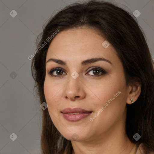 Joyful white young-adult female with long  brown hair and brown eyes