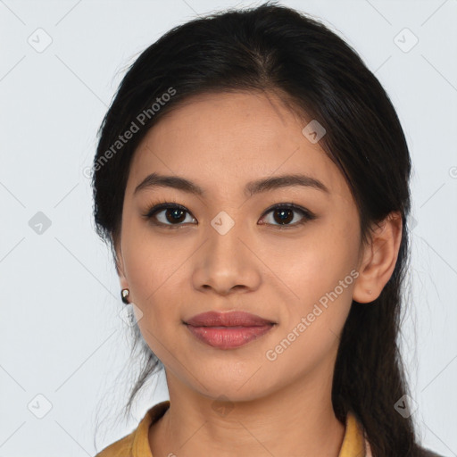 Joyful latino young-adult female with long  brown hair and brown eyes