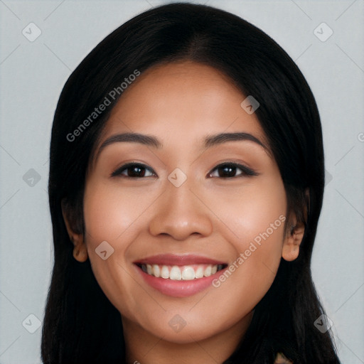 Joyful latino young-adult female with long  black hair and brown eyes