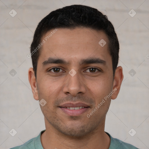 Joyful white young-adult male with short  black hair and brown eyes