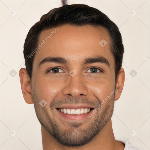 Joyful white young-adult male with short  brown hair and brown eyes