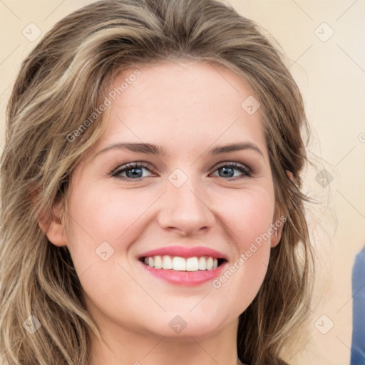 Joyful white young-adult female with medium  brown hair and green eyes