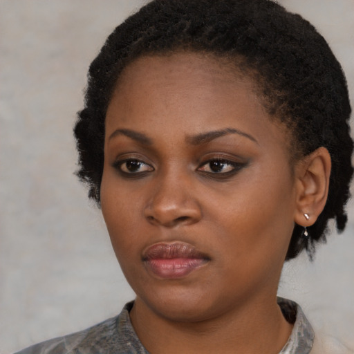 Neutral black young-adult female with short  black hair and brown eyes