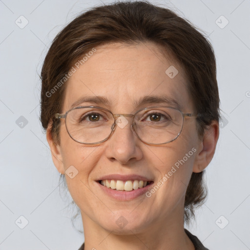 Joyful white adult female with medium  brown hair and brown eyes