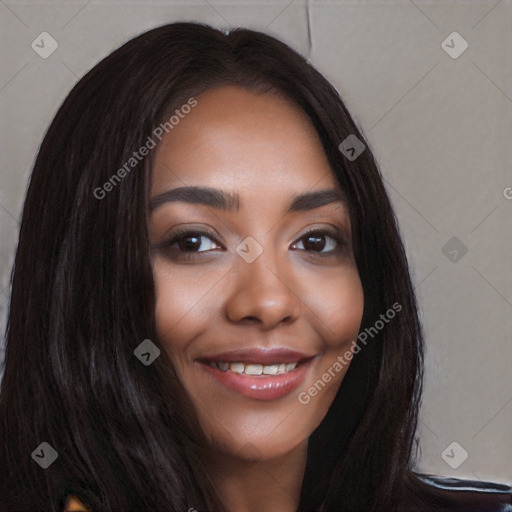 Joyful black young-adult female with long  black hair and brown eyes