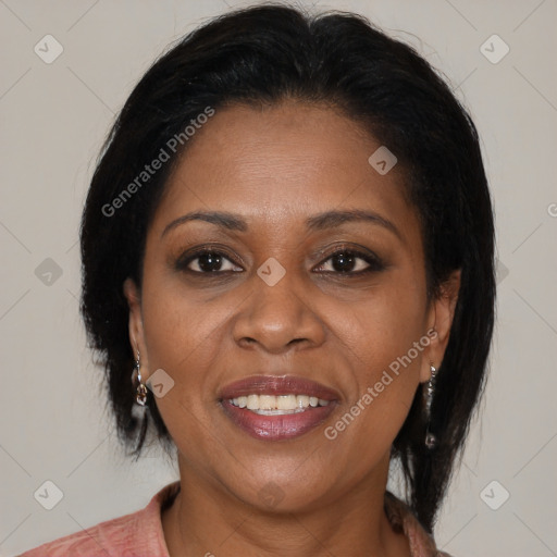 Joyful black adult female with medium  brown hair and brown eyes