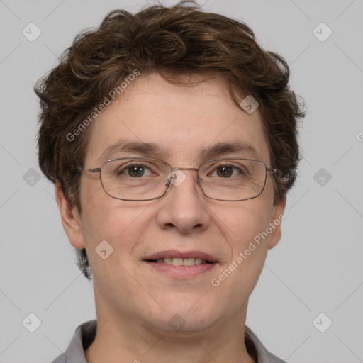 Joyful white adult female with short  brown hair and grey eyes