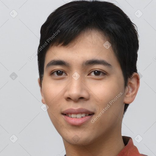 Joyful asian young-adult male with short  black hair and brown eyes