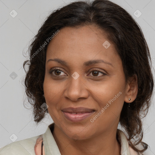 Joyful black young-adult female with medium  brown hair and brown eyes