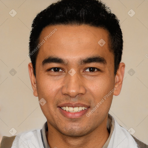 Joyful white young-adult male with short  black hair and brown eyes