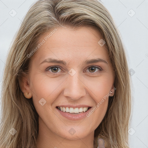 Joyful white young-adult female with long  brown hair and brown eyes