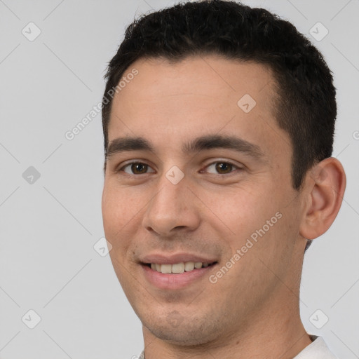 Joyful white young-adult male with short  brown hair and brown eyes