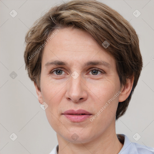 Joyful white adult female with short  brown hair and grey eyes