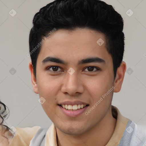 Joyful latino young-adult male with short  black hair and brown eyes