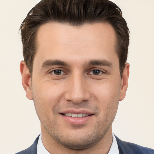 Joyful white young-adult male with short  brown hair and brown eyes