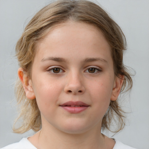 Joyful white child female with medium  brown hair and brown eyes