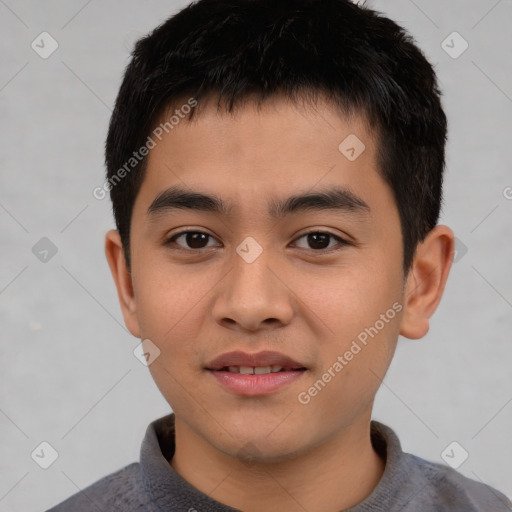 Joyful asian child male with short  brown hair and brown eyes