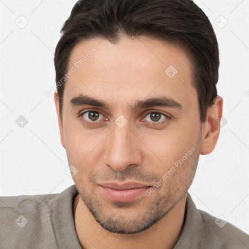 Joyful white young-adult male with short  brown hair and brown eyes