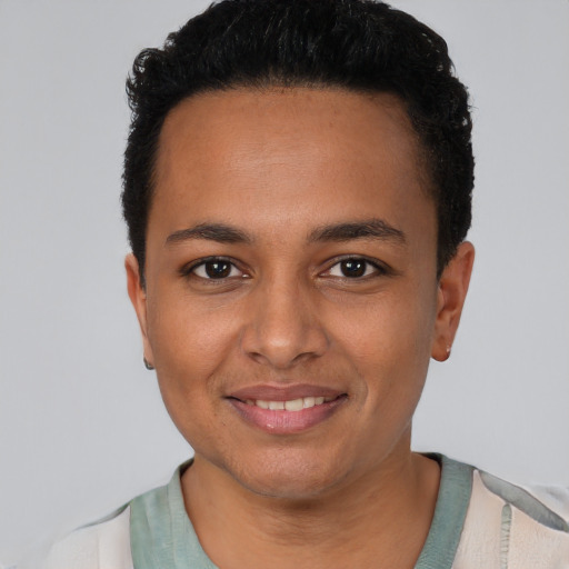 Joyful latino young-adult female with short  black hair and brown eyes