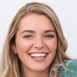 Joyful white young-adult female with long  brown hair and green eyes