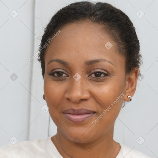 Joyful latino adult female with short  brown hair and brown eyes
