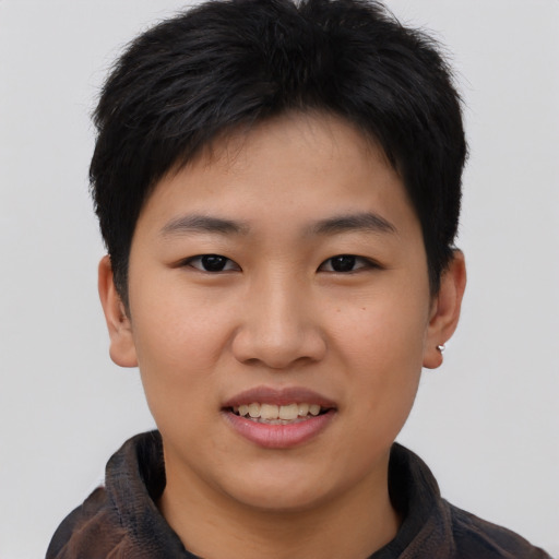 Joyful asian young-adult female with short  black hair and brown eyes