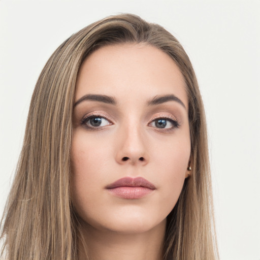 Neutral white young-adult female with long  brown hair and brown eyes