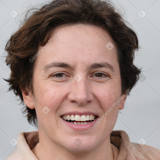 Joyful white adult female with short  brown hair and brown eyes