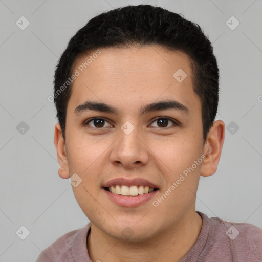 Joyful latino young-adult male with short  brown hair and brown eyes