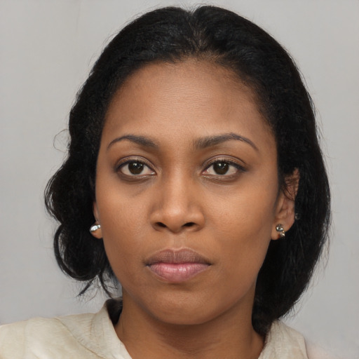 Neutral black young-adult female with long  brown hair and brown eyes