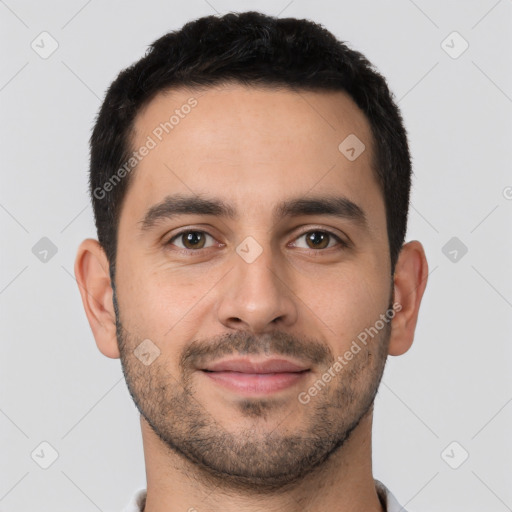 Joyful white young-adult male with short  brown hair and brown eyes