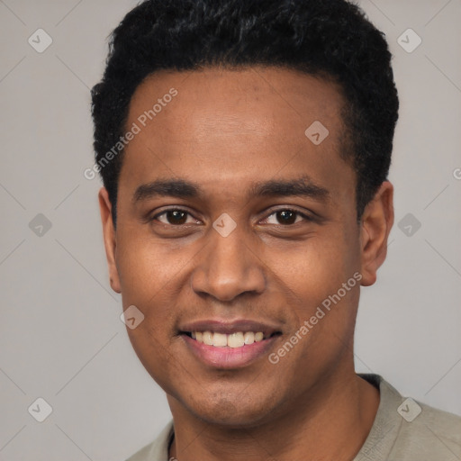 Joyful black young-adult male with short  black hair and brown eyes
