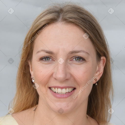 Joyful white adult female with medium  brown hair and grey eyes