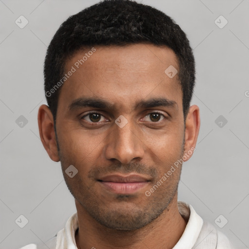 Joyful black young-adult male with short  black hair and brown eyes