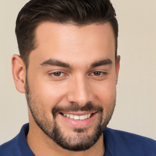 Joyful white young-adult male with short  brown hair and brown eyes