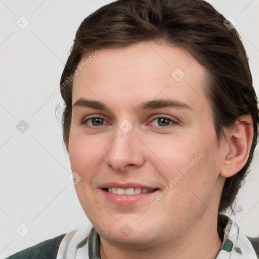 Joyful white young-adult female with medium  brown hair and grey eyes