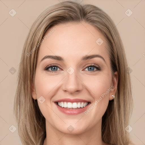 Joyful white young-adult female with long  brown hair and green eyes