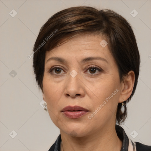 Joyful white adult female with medium  brown hair and brown eyes