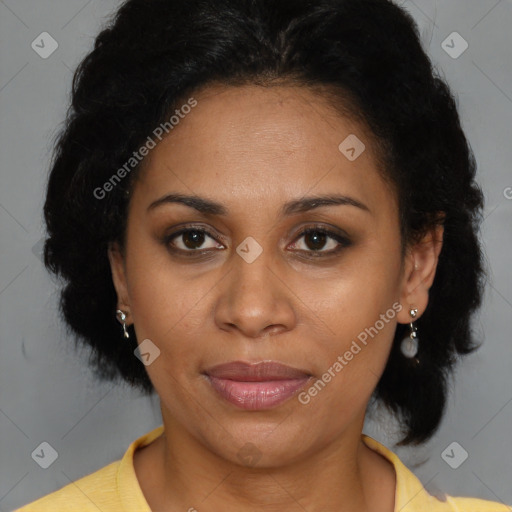 Joyful latino adult female with short  brown hair and brown eyes