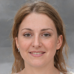 Joyful white adult female with medium  brown hair and grey eyes