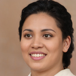 Joyful latino young-adult female with medium  brown hair and brown eyes