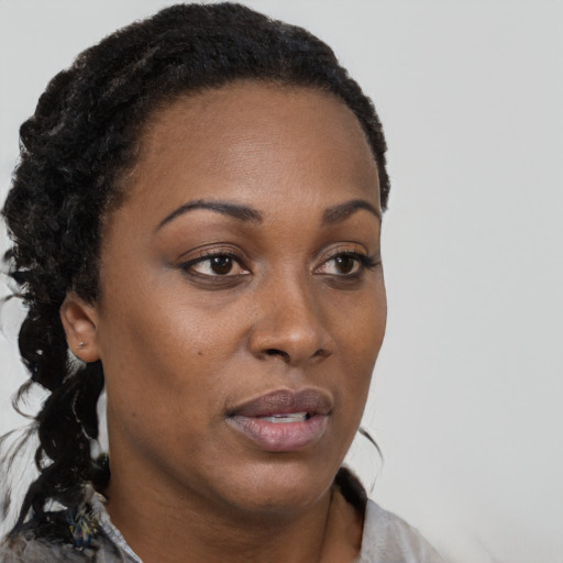 Neutral black young-adult female with short  brown hair and brown eyes
