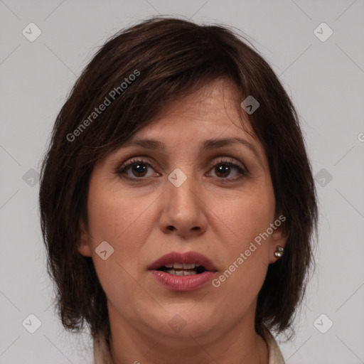 Joyful white adult female with medium  brown hair and brown eyes