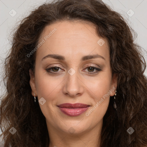 Joyful white adult female with long  brown hair and brown eyes