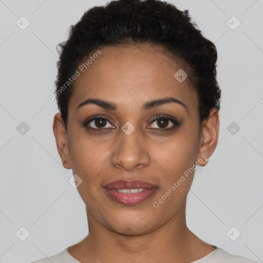 Joyful black young-adult female with short  black hair and brown eyes