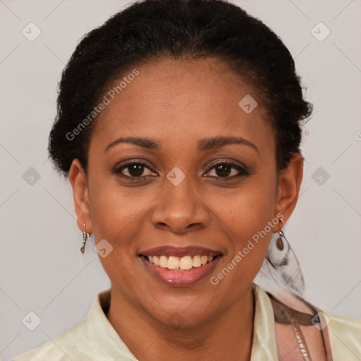 Joyful latino adult female with short  brown hair and brown eyes