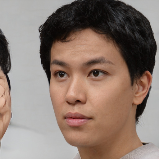Neutral asian young-adult male with short  black hair and brown eyes