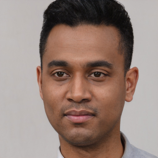 Neutral latino young-adult male with short  black hair and brown eyes
