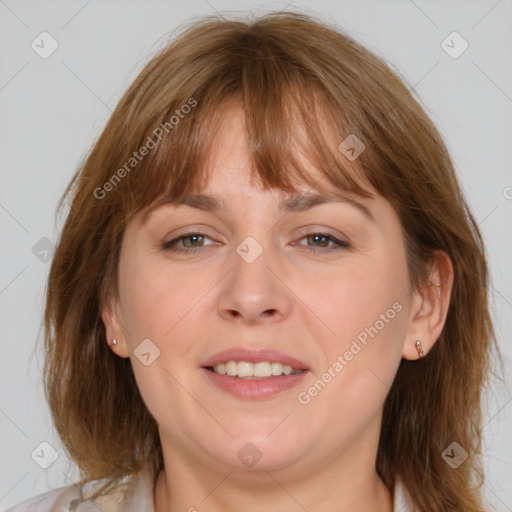 Joyful white adult female with medium  brown hair and brown eyes